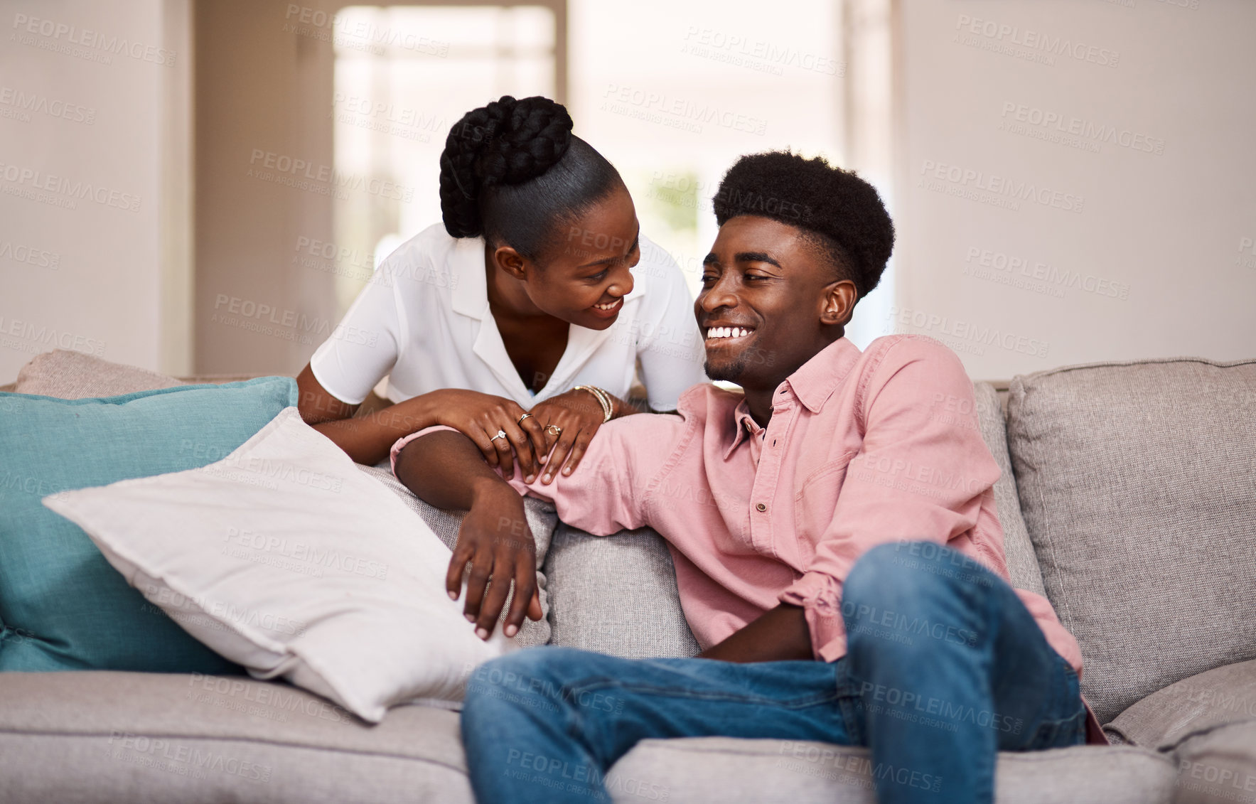 Buy stock photo Happy, home and black couple with love, conversation and romance with relationship, talking and smile. African people, man or woman in living room, bonding together or weekend break with humor or joy