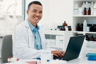 Buy stock photo Portrait of a young scientist using a laptop while working in a laboratory