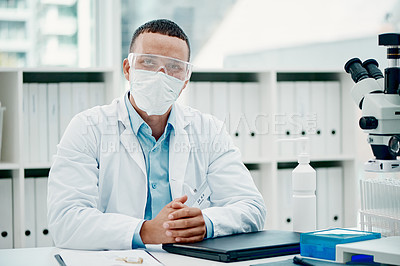 Buy stock photo Portrait of a young scientist using a laptop while working on a coronavirus cure in a laboratory