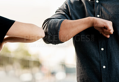 Buy stock photo Closeup, man and woman elbow greeting to avoid the spread of coronavirus or COVID-19 infection and outdoors. Social distancing, health and wellness or fear of pandemic or meet in the street outside