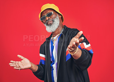 Buy stock photo Senior black man, casual or fashion with vintage style for trendy casual outfit in studio on red background. African person, confident and accessory for cool retro clothes, attitude or sunglasses