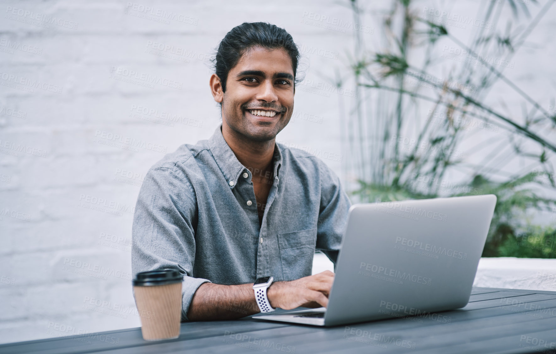 Buy stock photo Employee, Indian man and smile at cafe on laptop with coffee for research with creative ideas as website designer. Business person, portrait and remote work with browsing internet as freelancer