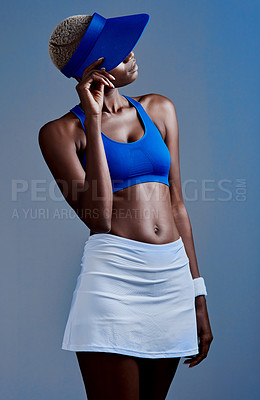 Buy stock photo Tennis, hat and black woman thinking in studio for workout, exercise and fitness at competition. African athlete, uniform and idea with visor by blue background for game, training and sports practice