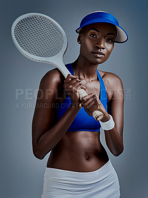 Buy stock photo Exercise, portrait and black woman with tennis racket in studio for competition, practice and training. African person, serious and visor with equipment for sports, workout or game by blue background