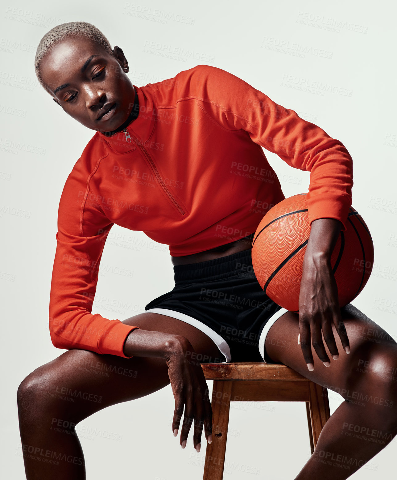 Buy stock photo Black woman, basketball and sports in studio for fitness with thinking, sad and depression by white background. Person, athlete and anxiety with mistake, competition or regret lost game on wood stool