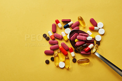 Buy stock photo Medicine, pills and food with spoon in studio of healthy cure medical nutrition and prescription diet. Drugs, choice and tablets for daily routine, healthcare meal and treatment on yellow background