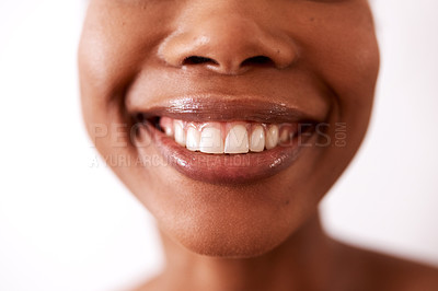 Buy stock photo Studio shot of an unrecognizable woman smiling against a white background