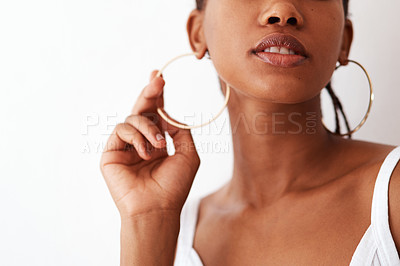 Buy stock photo Studio shot of an unrecognizable woman wearing gold hoop earrings