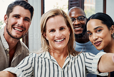 Buy stock photo Cropped portrait of a group of business colleagues taking selfies in the office