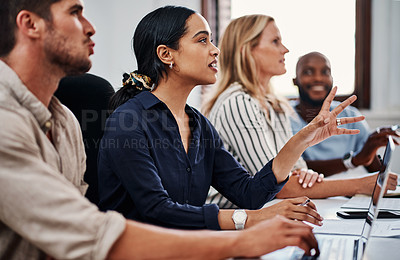 Buy stock photo Cropped shot of a group of business colleagues having a strategy meeting in the boardroom