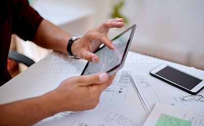 Buy stock photo Closeup shot of an unrecognisable architect using a digital tablet in an office