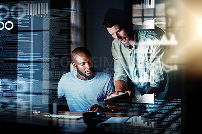 Buy stock photo Shot of two programmers using a digital tablet while working together on a computer code at night