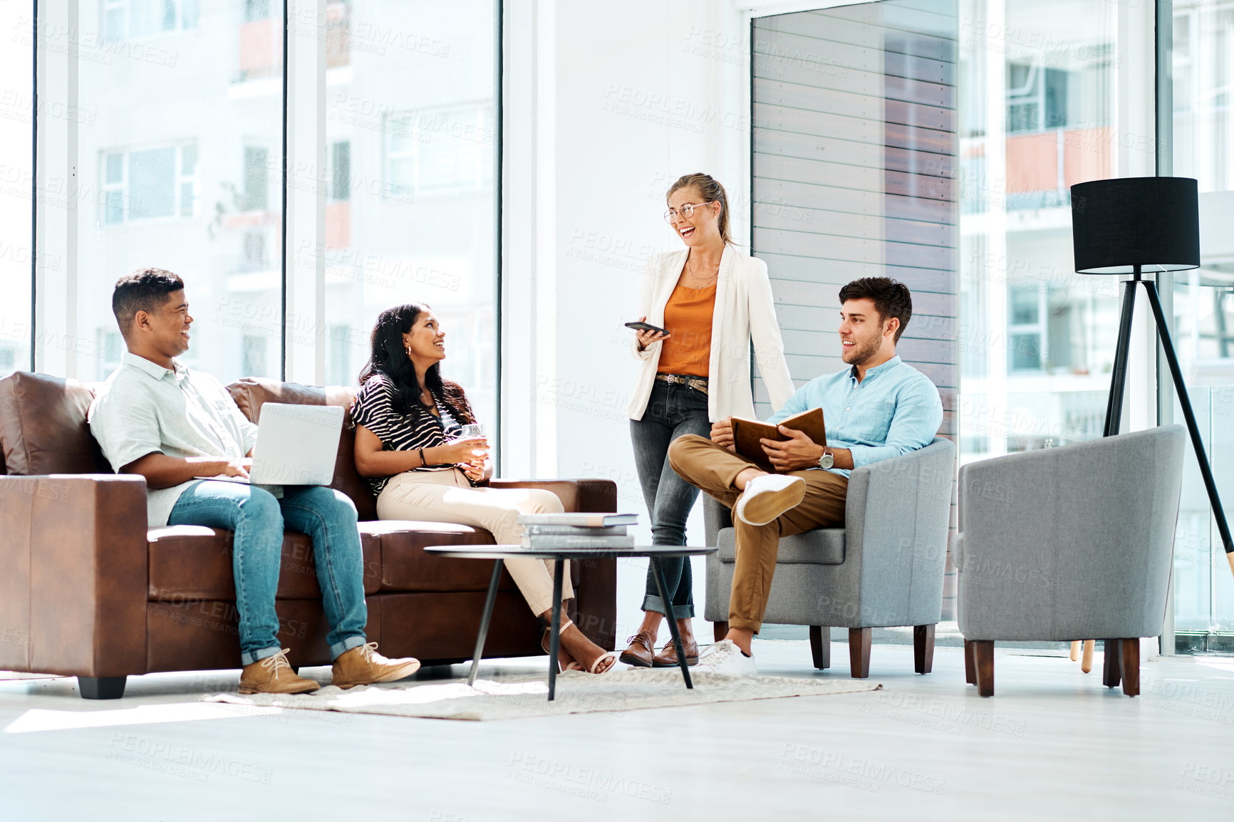 Buy stock photo Shot of a group of businesspeople having a discussion in an office