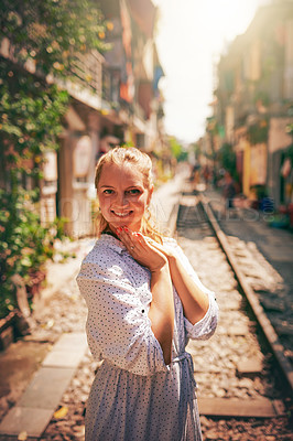 Buy stock photo City, happy and portrait of woman on train tracks for holiday, vacation and adventure in Vietnam. Fashion, smile and person on railway for journey, tourist destination and sightseeing in urban town