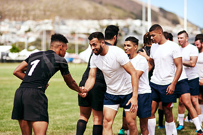 Buy stock photo Rugby, team and handshake for greeting, introduction or sportsmanship on grass field outdoors. Sports men shaking hands and welcome for game rival, competition or training with workout and exercise