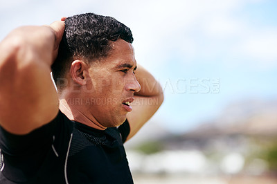 Buy stock photo Shot of a young man playing a game of rugby