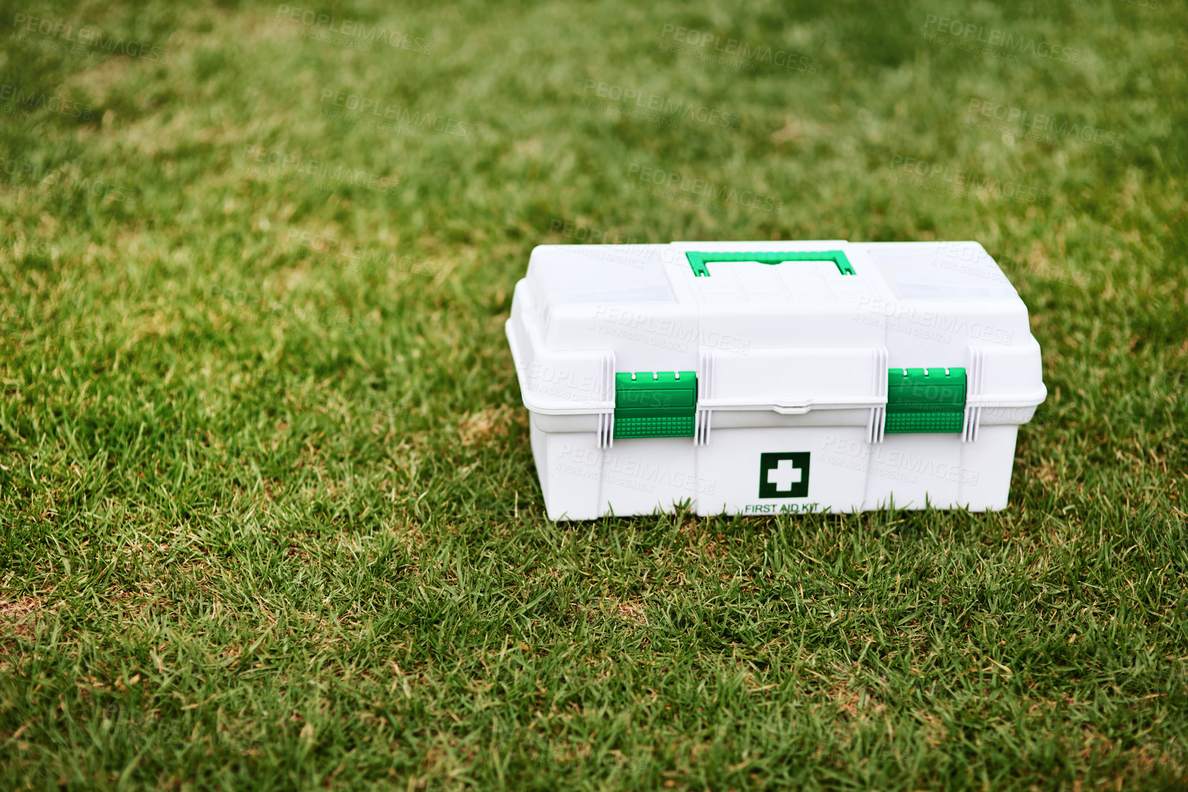 Buy stock photo Shot of a first aid kit on a rugby field