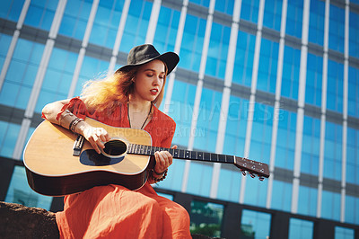 Buy stock photo City, woman and musician with guitar for sound, playing and creative skill for jazz music outdoor. Urban, female person and guitarist with instrument for strumming strings, acoustic audio and talent