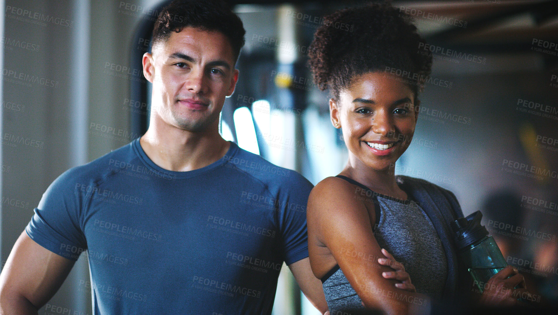 Buy stock photo Portrait of two sporty young people at the gym