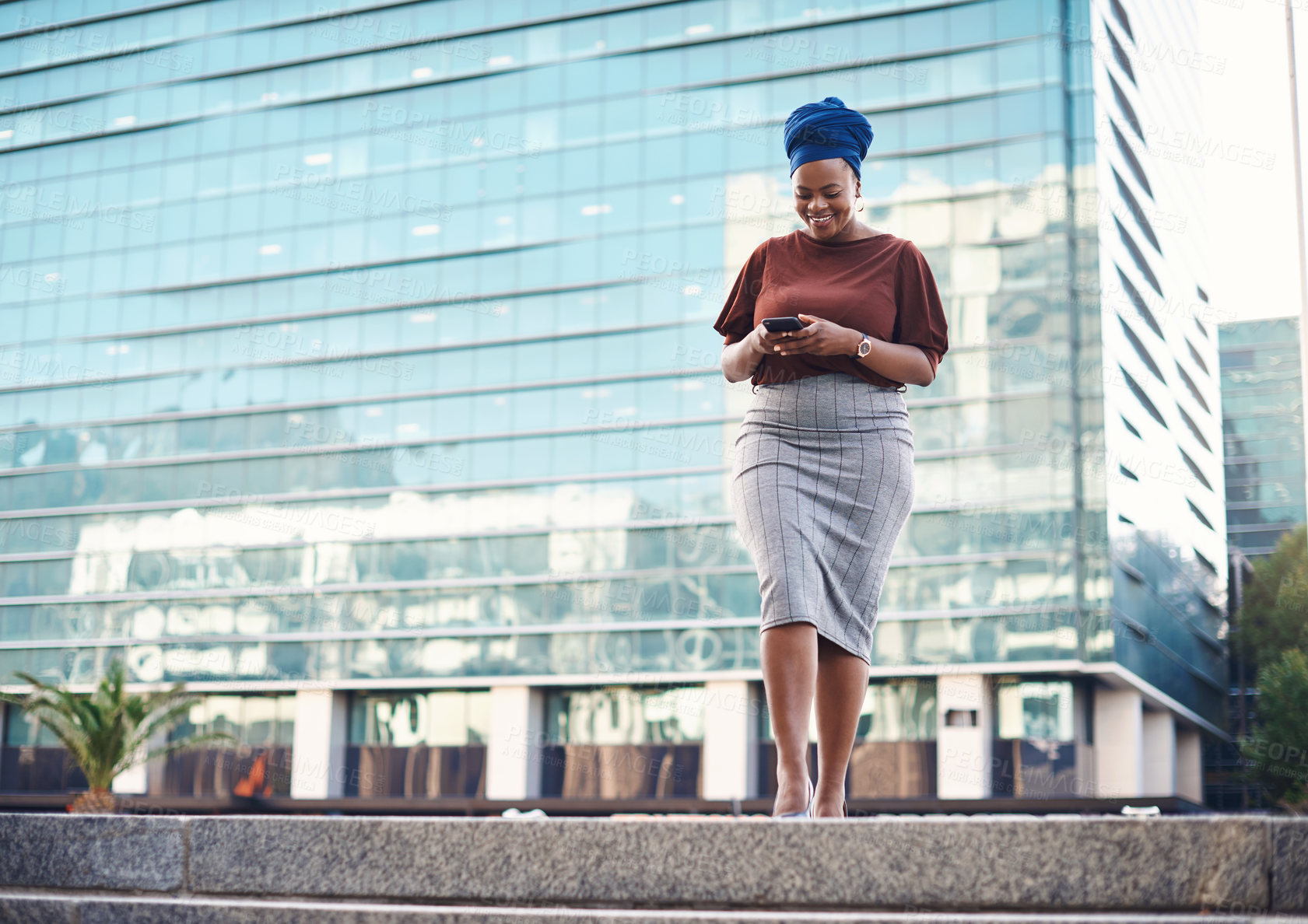 Buy stock photo Black woman, phone and city travel walking of a employee with happiness and social network. African female person, mobile communication text and networking with tech and internet by urban streets 