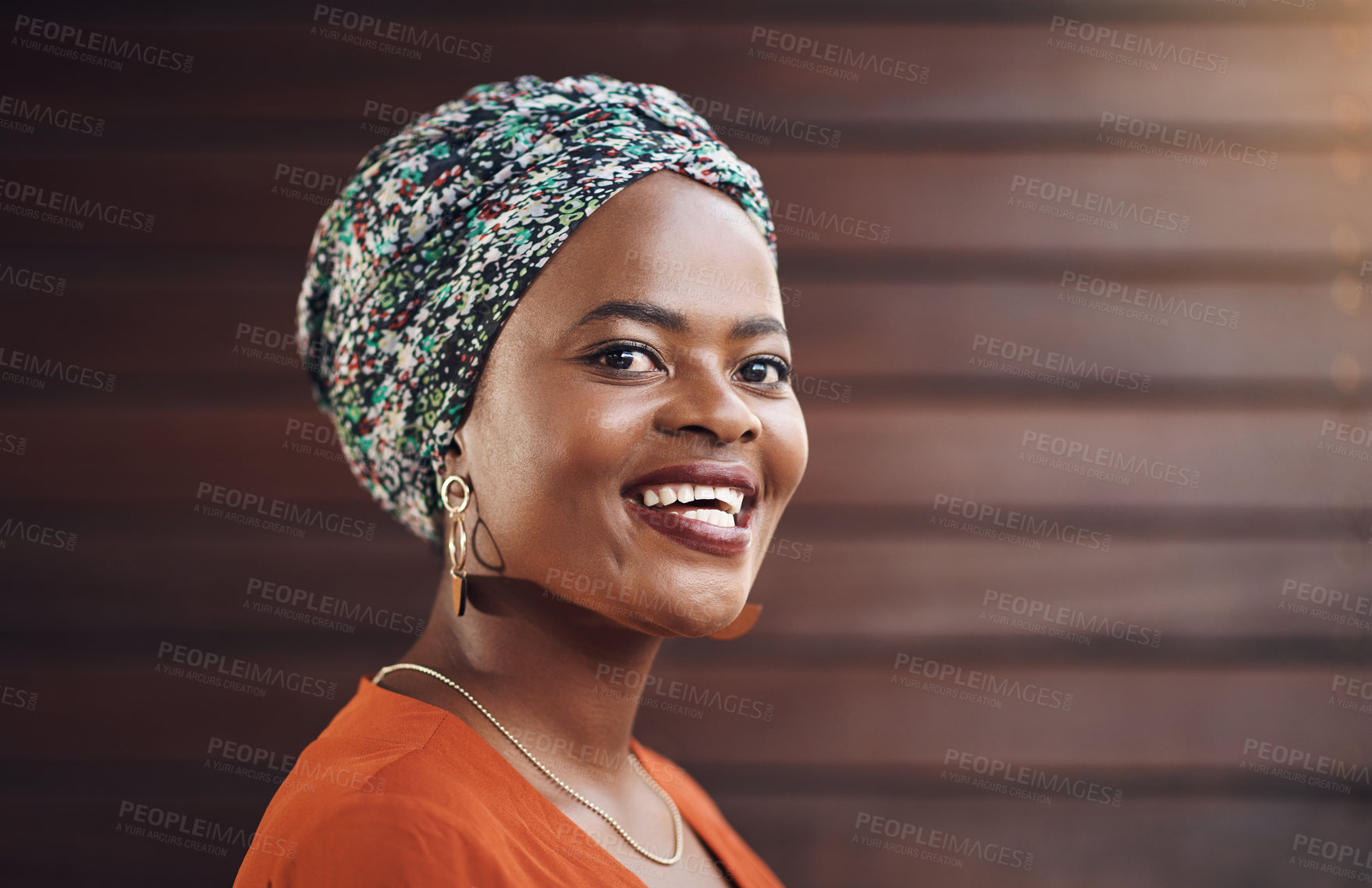 Buy stock photo Pride, creative and portrait of black woman by office with confidence for fashion career. Happy, startup and face of professional female designer with turban from Nigeria by wood wall in workplace.