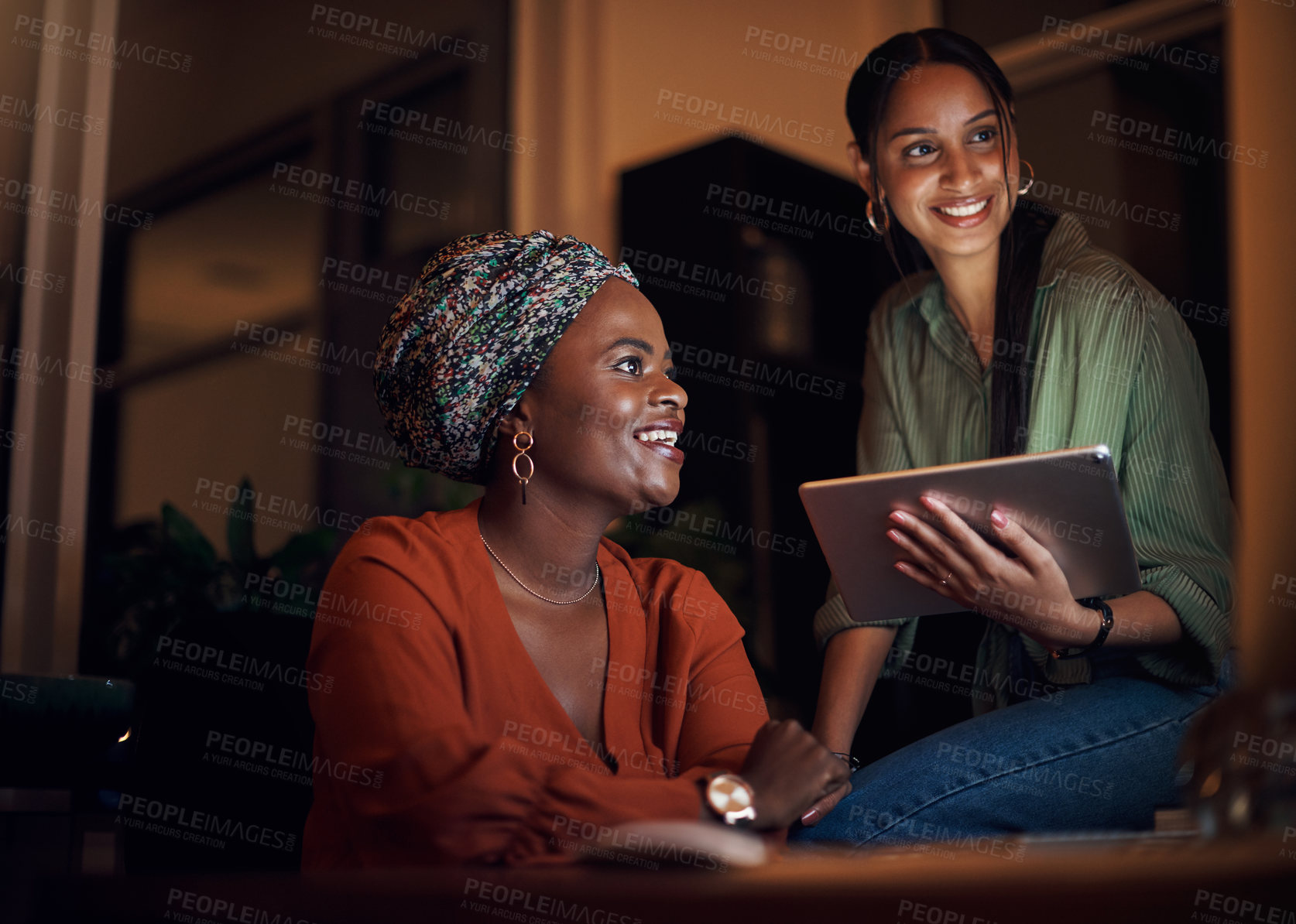 Buy stock photo Business women, working late and collaboration in office with pointing at computer screen. Female people, partner and teamwork for deadline, project or editing as online content creator for diversity