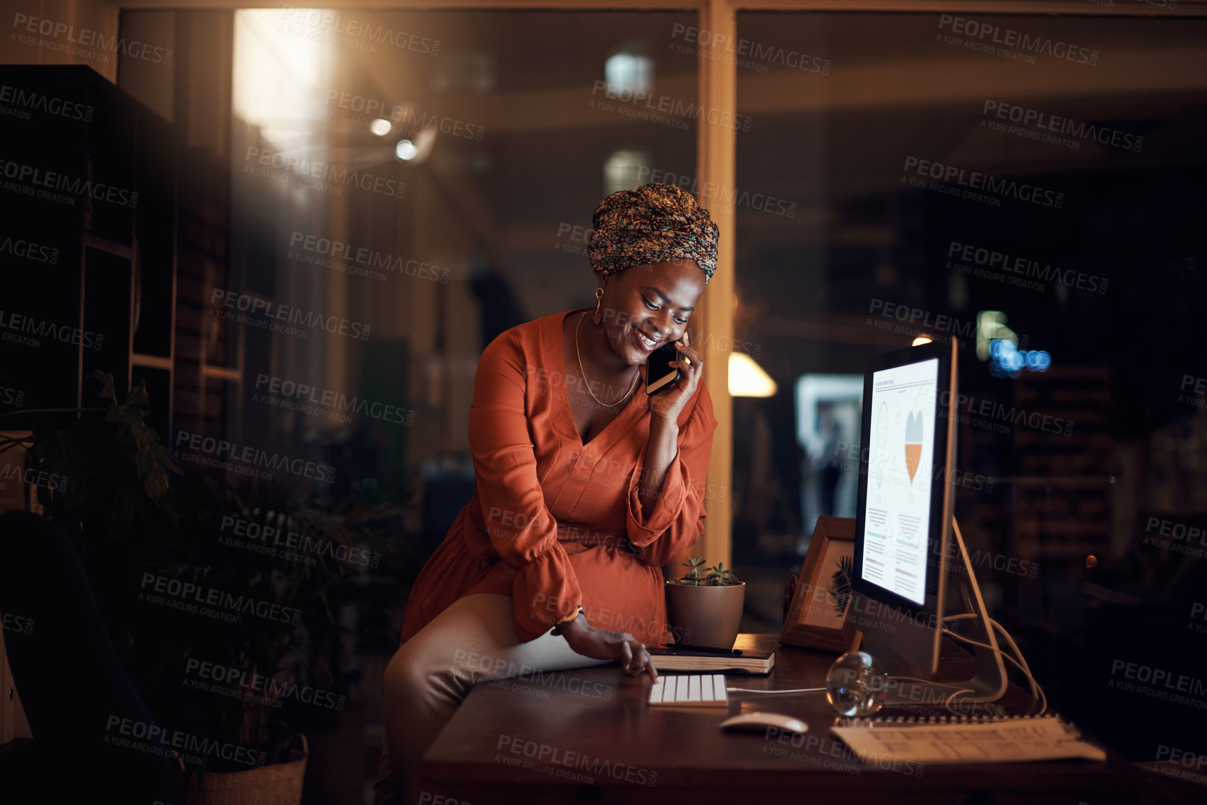 Buy stock photo Business, black woman and phone call on smartphone, computer typing and conversation at night. Happy worker, cellphone and communication for desktop management, mobile network and overtime in office