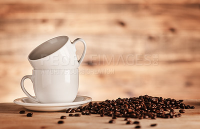 Buy stock photo Closeup shot of two cups surrounded by coffee beans