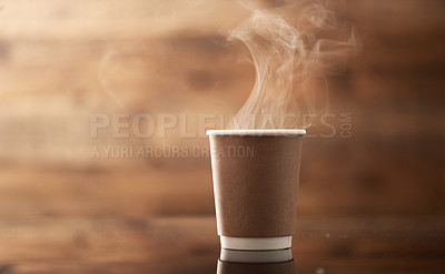 Buy stock photo Closeup shot of steam rising from a paper cup filled with a warm beverage