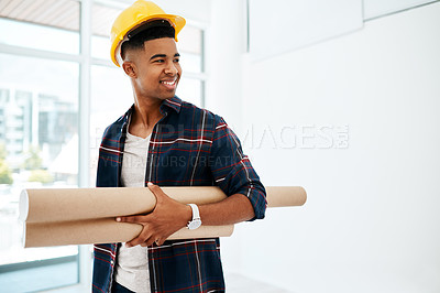 Buy stock photo Shot of a young man and woman holding a blueprint in a modern office