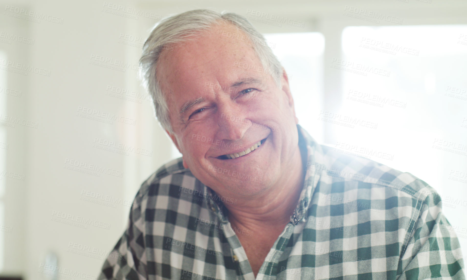 Buy stock photo Cropped shot of a happy senior man spending the day at home