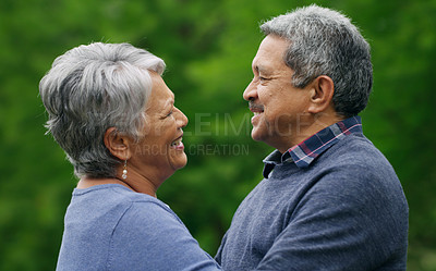 Buy stock photo Shot of a happy senior couple spending a romantic day in the park