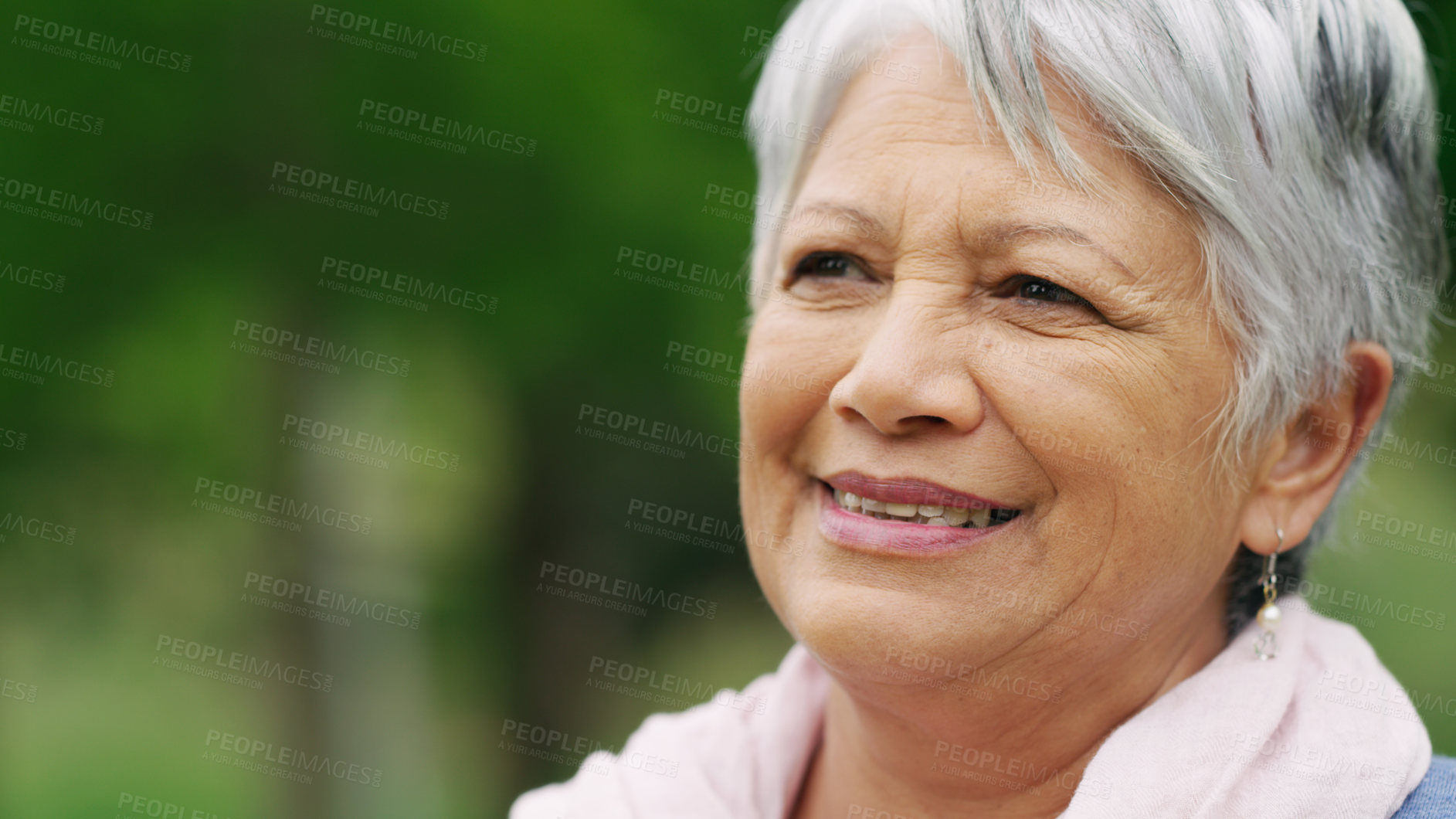 Buy stock photo Shot of a senior woman spending a day in the park