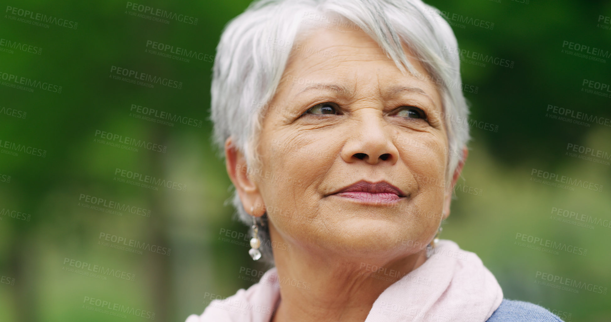 Buy stock photo Shot of a senior woman spending a day in the park