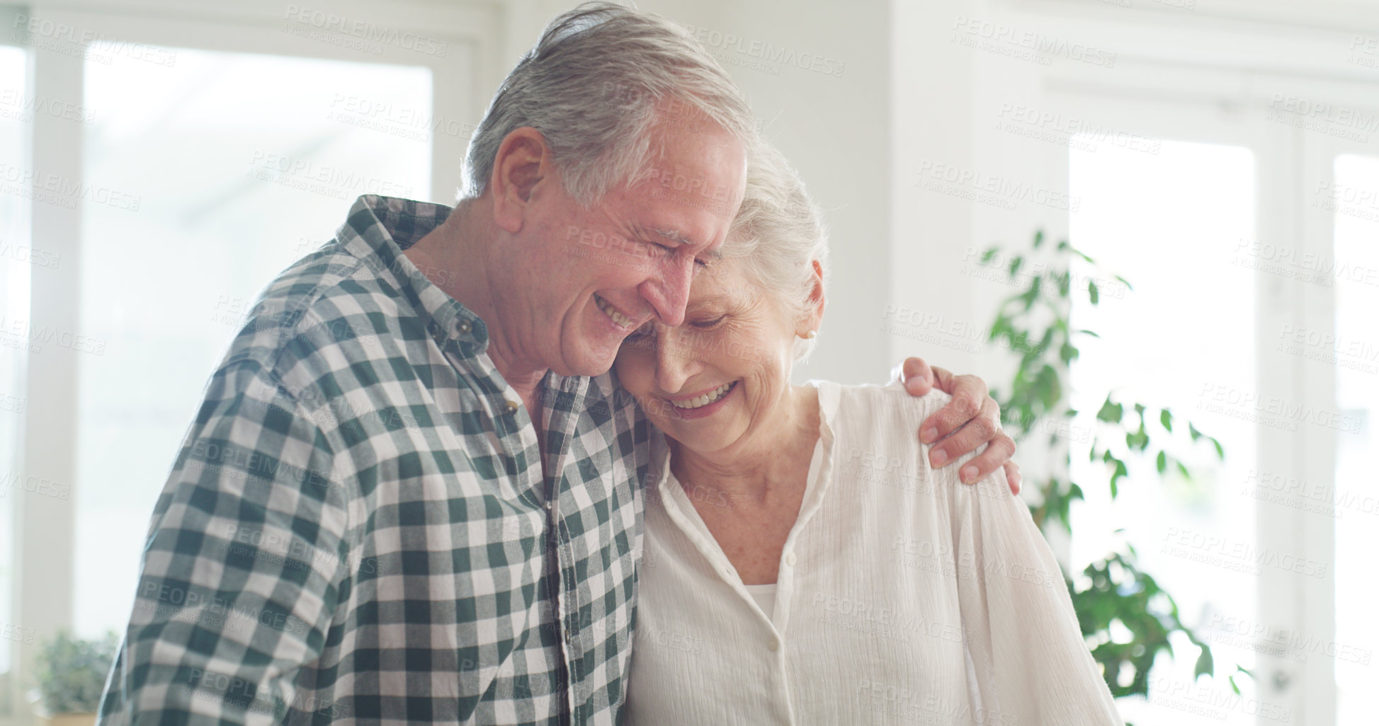 Buy stock photo Cropped shot of an affectionate couple spending time together at home