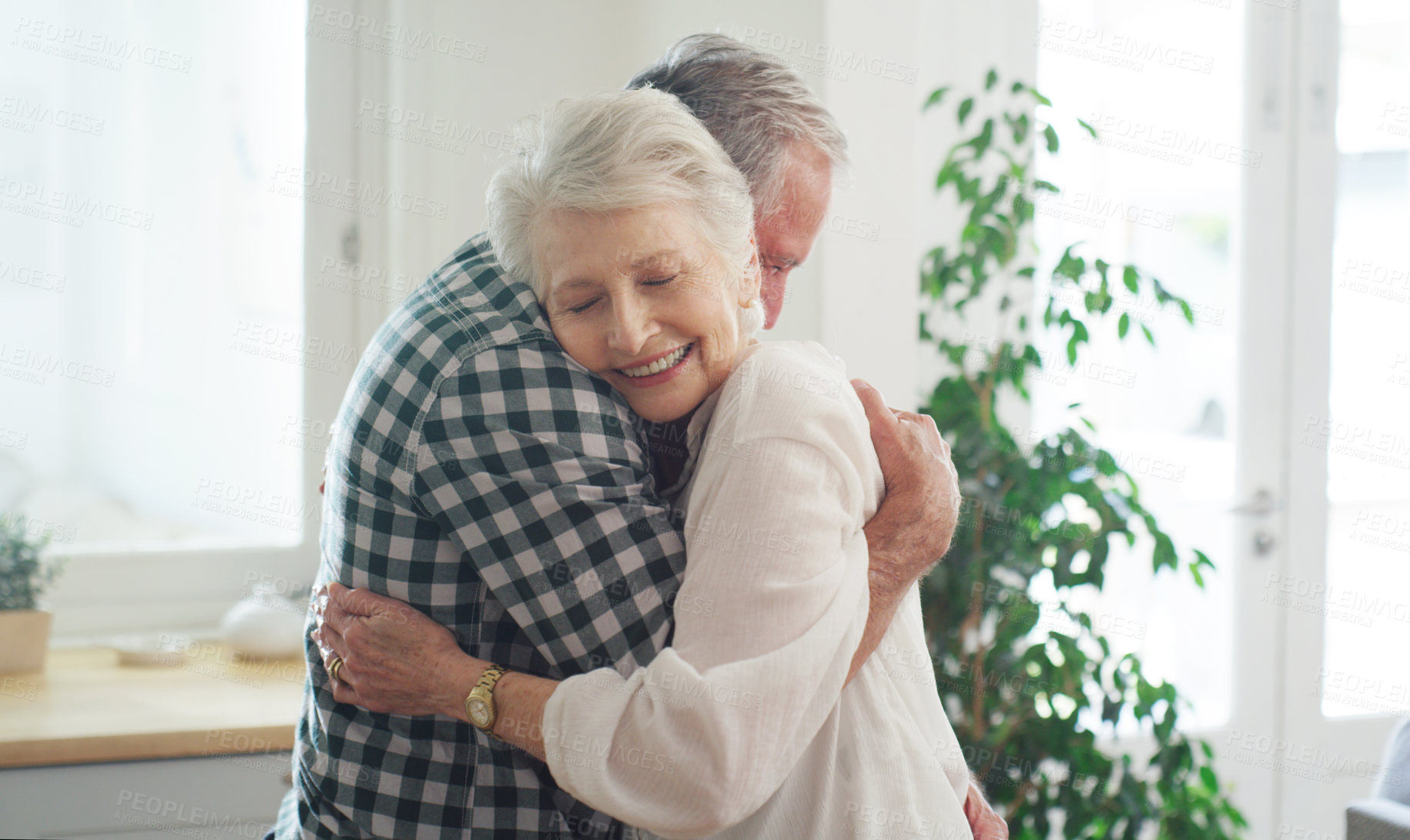 Buy stock photo Cropped shot of an affectionate couple spending time together at home