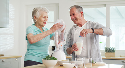 Buy stock photo Cropped shot of a senior couple making a healthy smoothie together at home