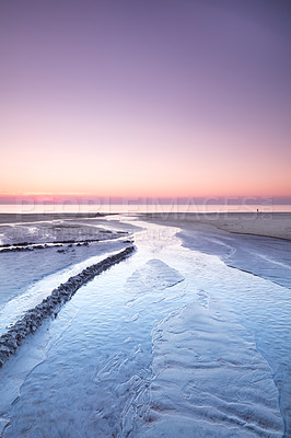 Buy stock photo Landscape view of a sunset in a pink sky on the beach and West Coast of Jutland, Denmark. A beautiful sunrise on the calm seashore for a getaway vacation and tourism. Peaceful scenery at the ocean