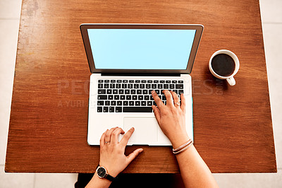 Buy stock photo High angle shot of an unrecognisable businesswoman using a laptop in an office