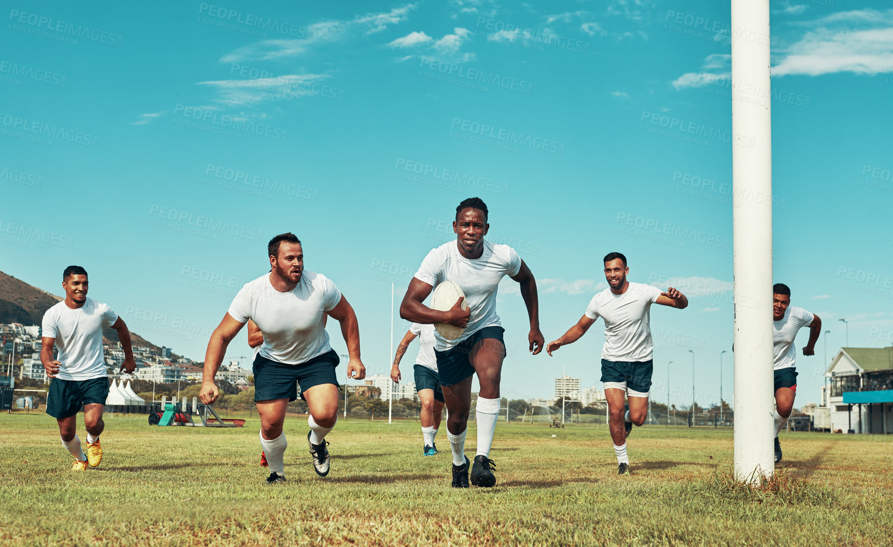 Buy stock photo Shot of a group of rugby players on a field