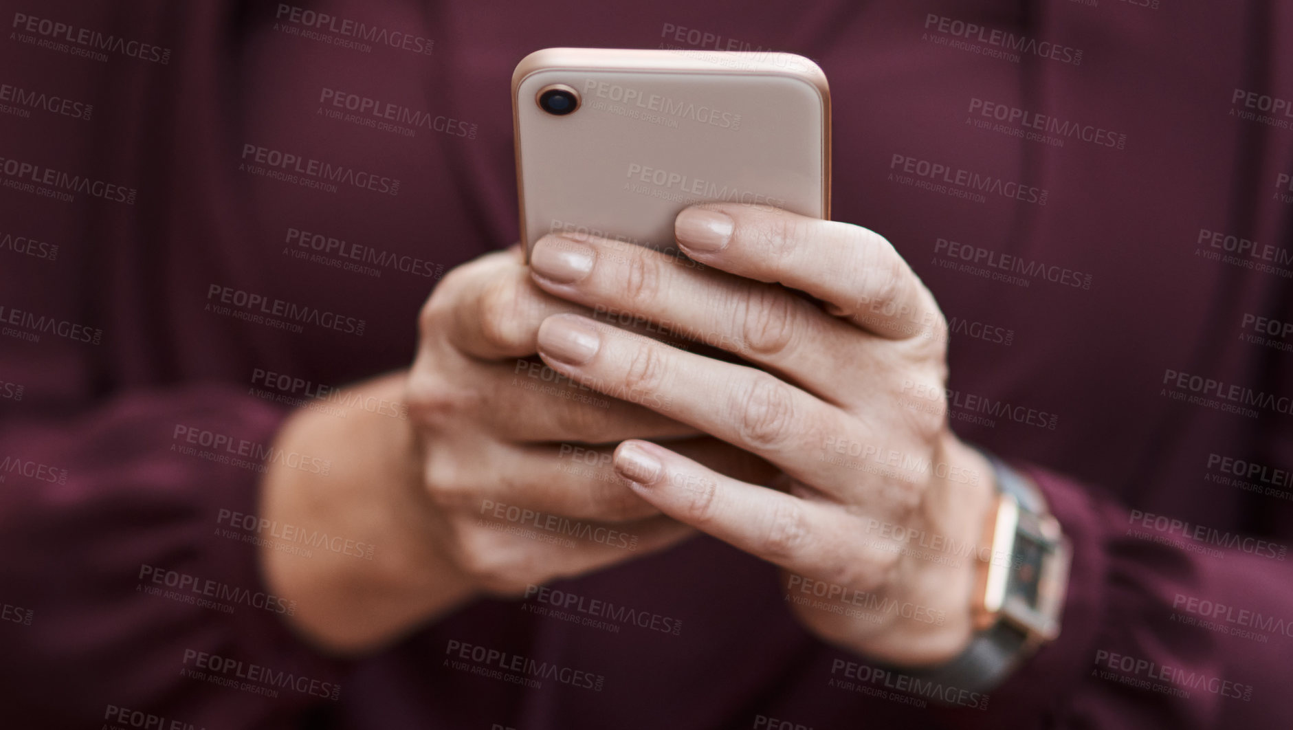 Buy stock photo Cropped shot of an unrecognisable businesswoman using a smartphone