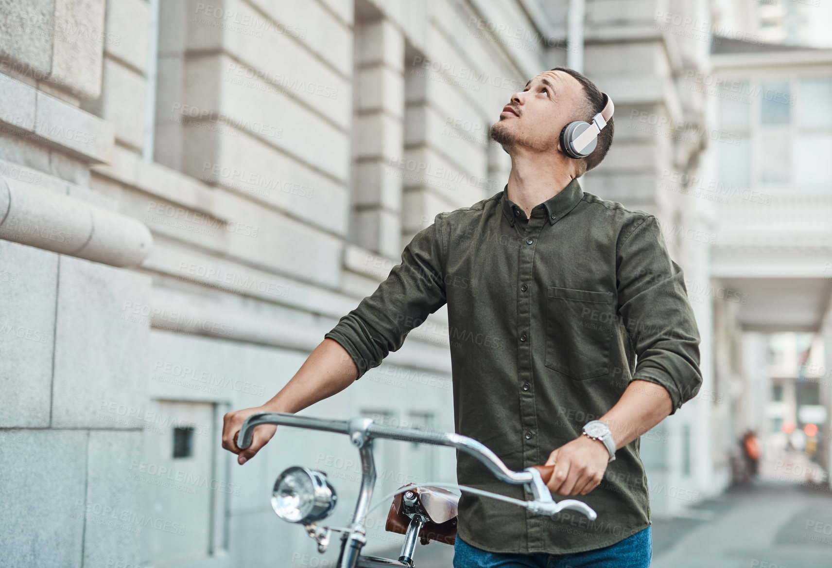 Buy stock photo Thinking, headphones and man with bicycle in city for morning commute, adventure and journey. Travel, cycling and person with bike listening to music for sustainable trip, explore and transport