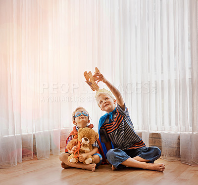 Buy stock photo Shot of two little boys playing together at home