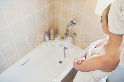 Buy stock photo Cropped shot of a beautiful young woman getting ready to take a bath at home with the words 