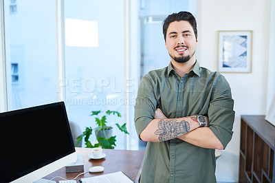 Buy stock photo Portrait of a young man standing with his arms crossed in an office