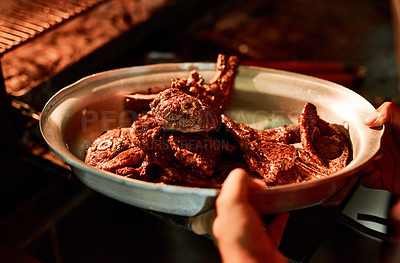 Buy stock photo Closeup shot of an unrecognisable man holding a dish of barbecued meat