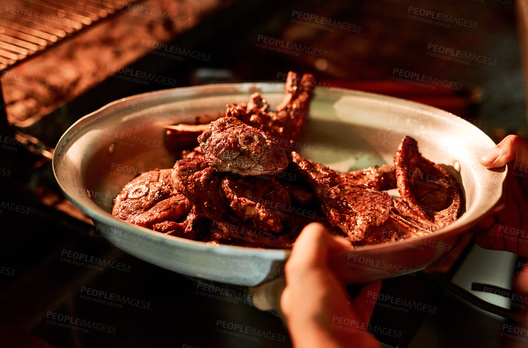 Buy stock photo Closeup shot of an unrecognisable man holding a dish of barbecued meat