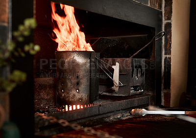 Buy stock photo Closeup shot of fire burning from a charcoal starter in a fireplace