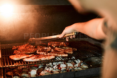 Buy stock photo Hands, meat and flames for barbecue, event and celebration on weekend or holiday with fireplace. Person, cooking and bbq as food for nutrition, dinner and beef on grill in party, reunion or backyard 