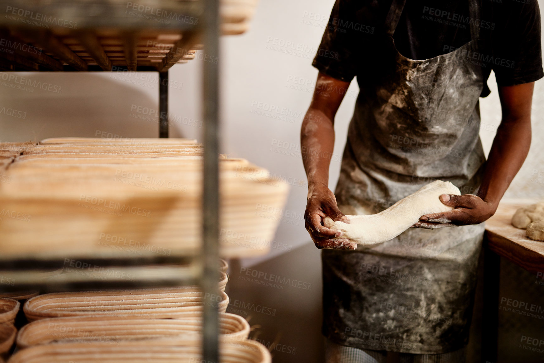 Buy stock photo Black man, hands and bakery with dough for bread, rolls or pastry production at storage warehouse. Closeup, male person or baker with flour, ingredients or wheat for handmade food or heast at factory